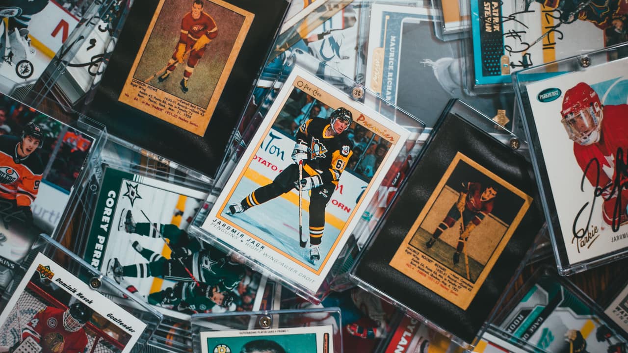 A close-up of assorted vintage and modern sports trading cards